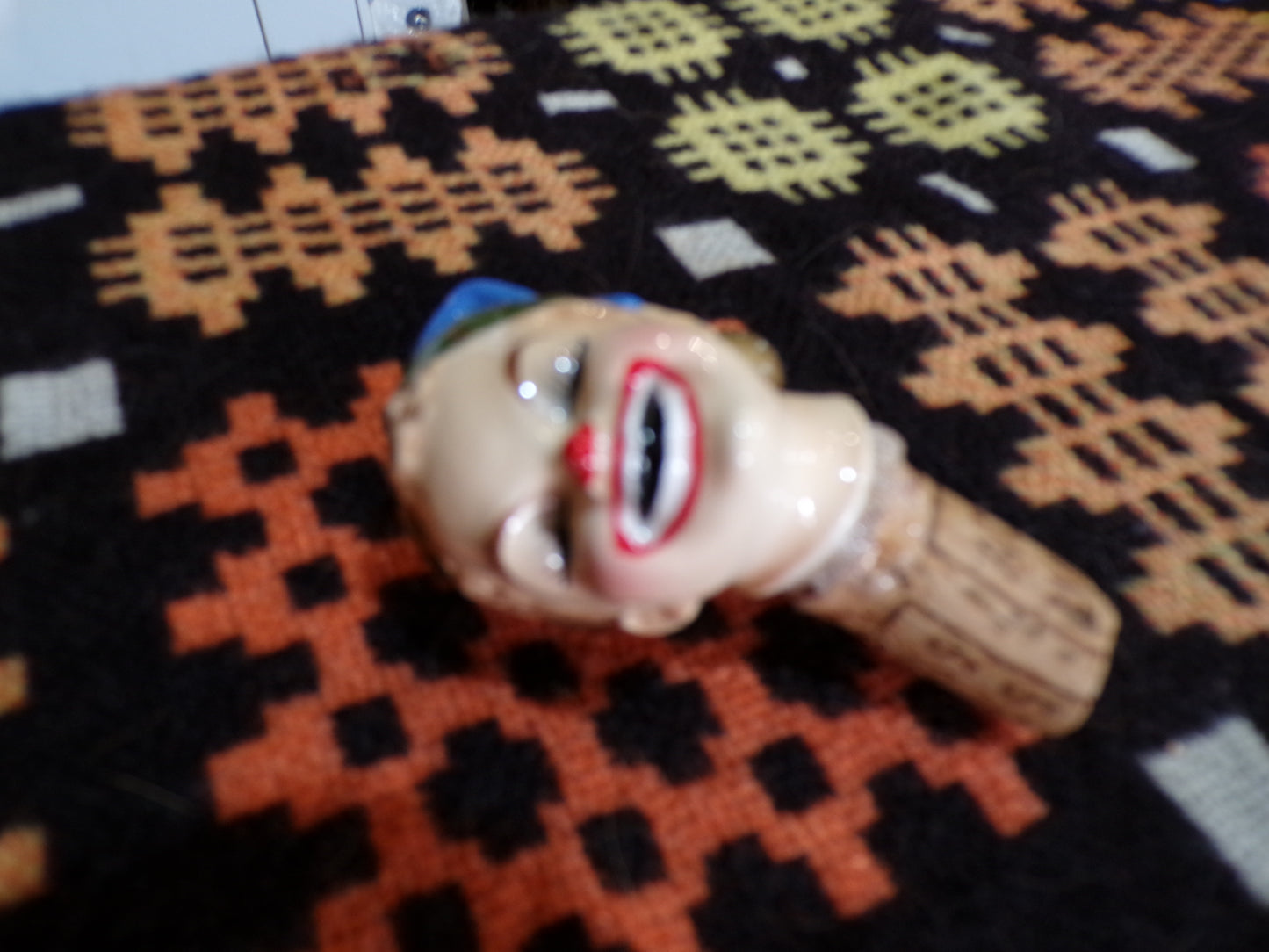 Mid C bottle stopper styled as an horrific clown/elf