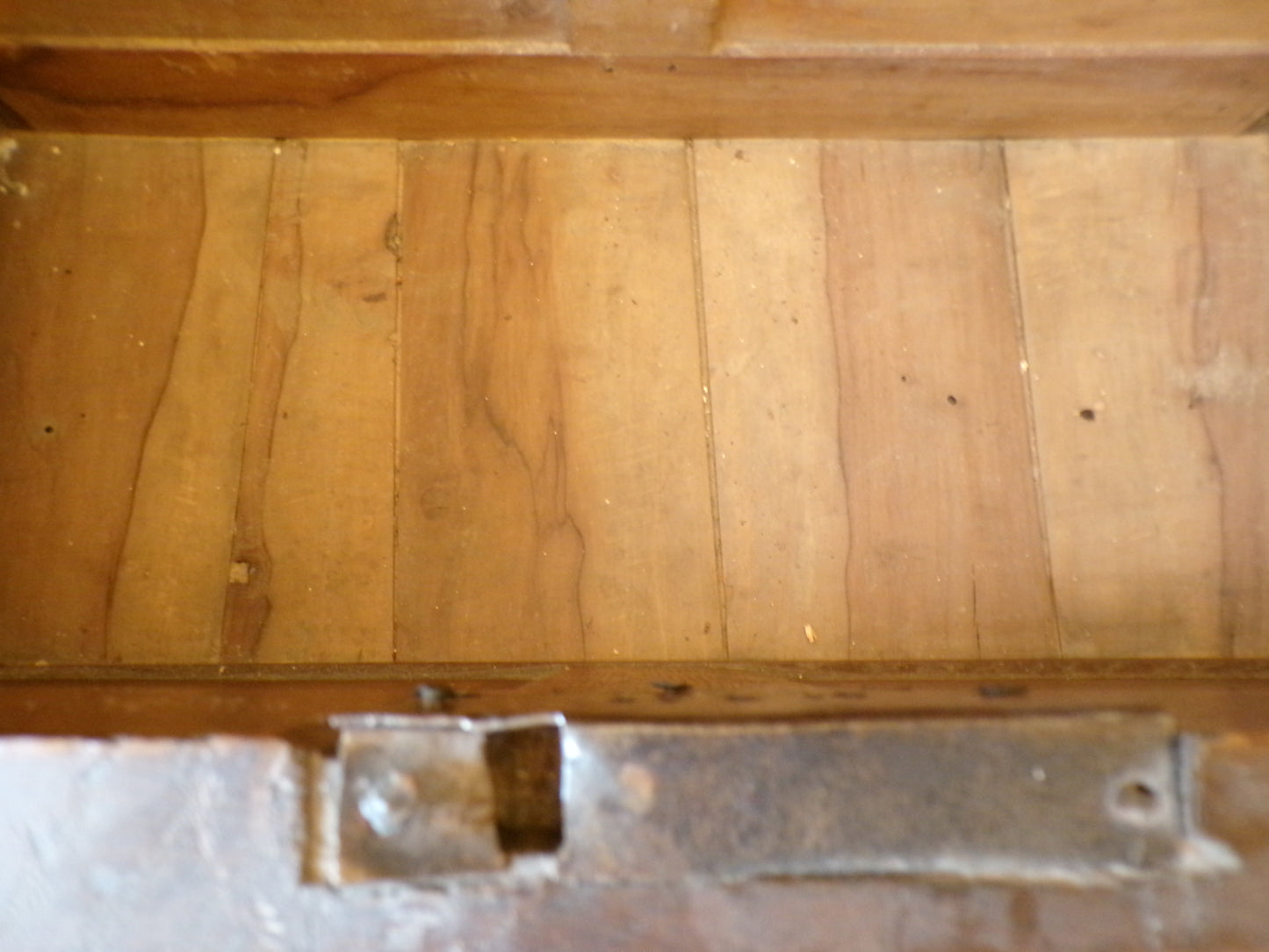 Seventeenth Century oak coffer with tulip and leafage carving surrounding two geometric mouldedpanels.