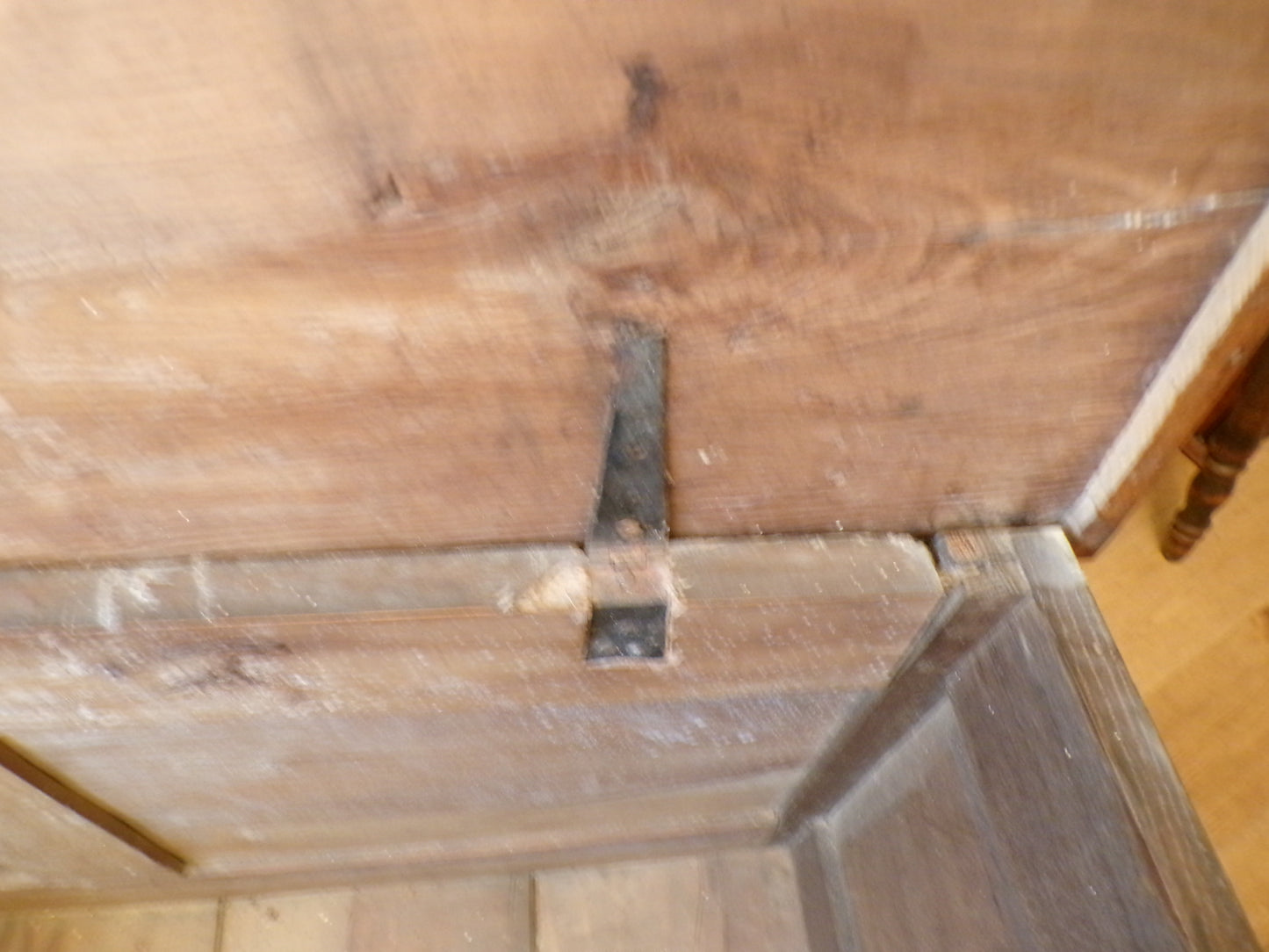 Seventeenth Century oak coffer with tulip and leafage carving surrounding two geometric mouldedpanels.