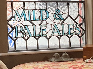 Antique restored stained glass window panels from a pub