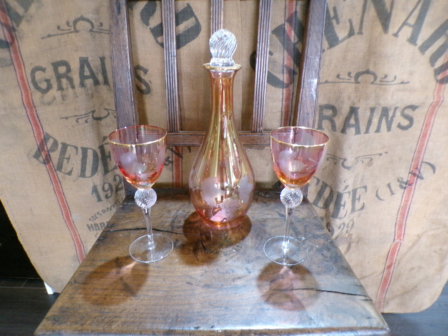 Three set Murano red and gold lustre mid century caraffe and wine glass set.