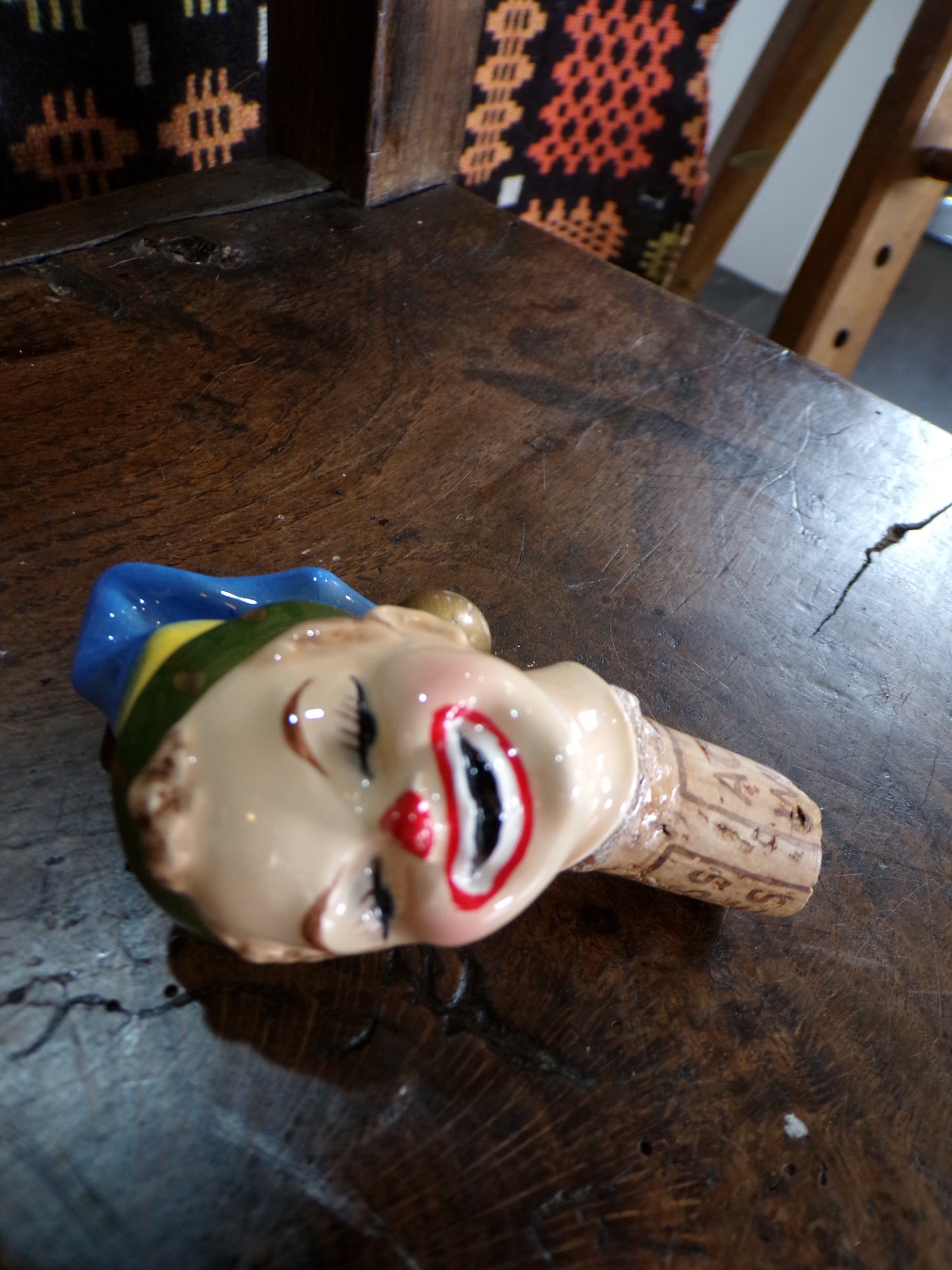 Mid C bottle stopper styled as an horrific clown/elf