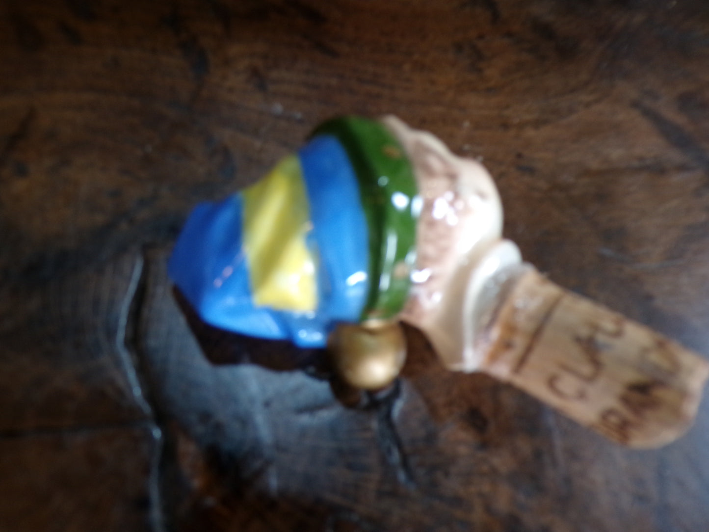 Mid C bottle stopper styled as an horrific clown/elf